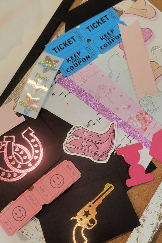 Disco Cowgirl ephemera kit with blue tickets, holographic stars, pink glitter paper, sheet music and western die cuts